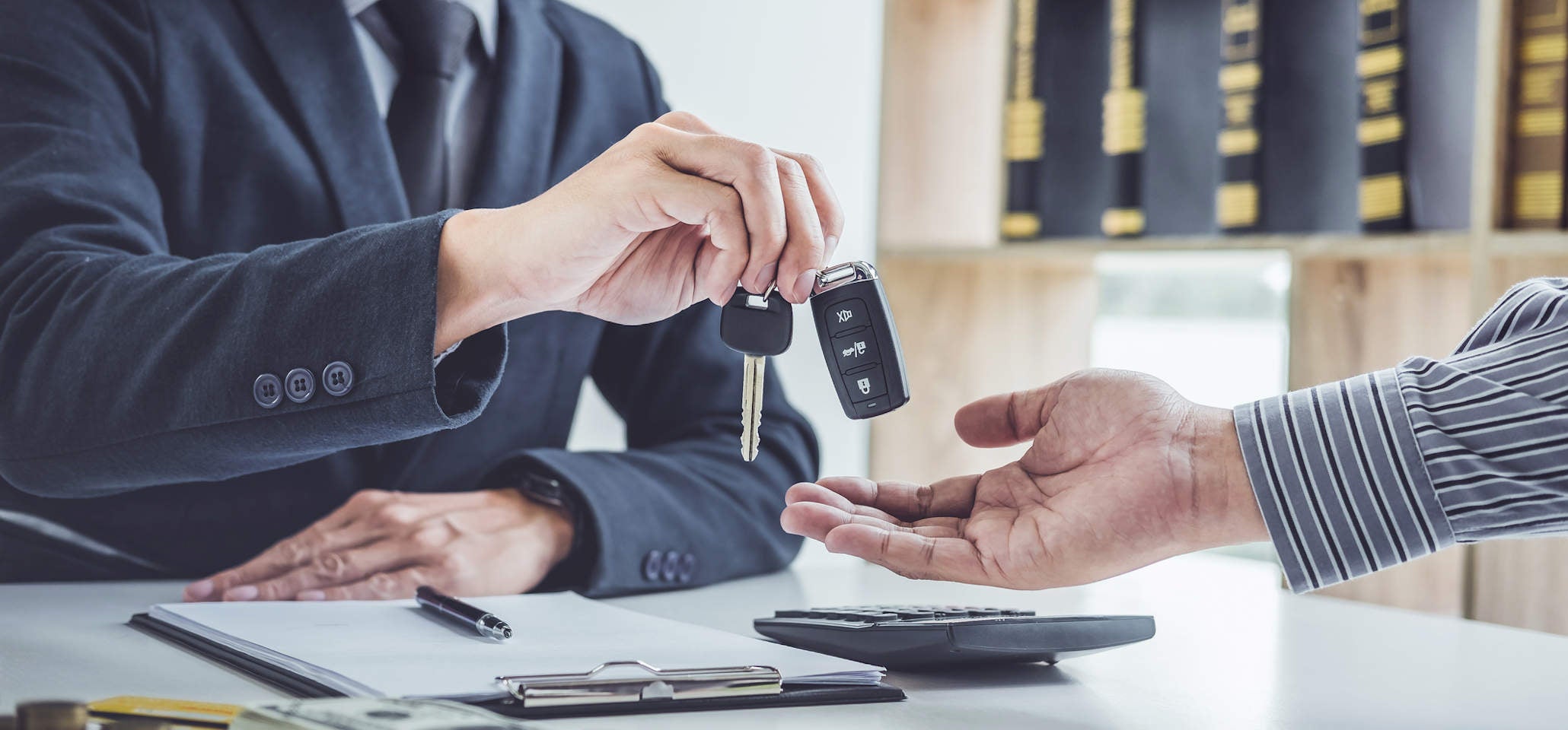 image of image of a man handing over keys
