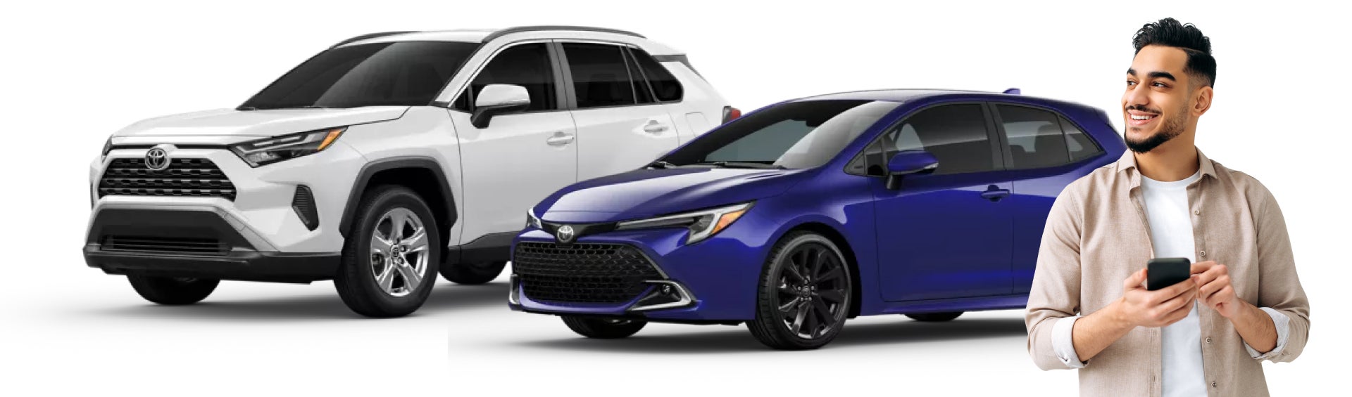 Man on the phone standing infront of a toyota lineup