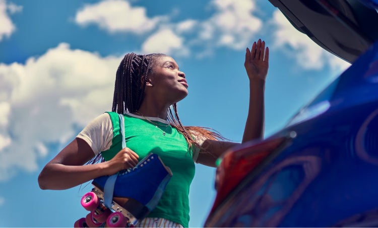 Lady closing the trunk