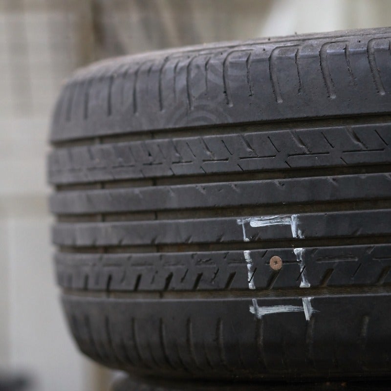 closeup image of a tire showing a hole to be patched